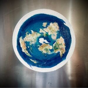 flat earth refrigerator magnet.